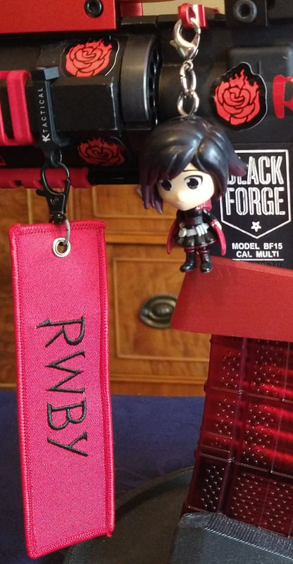 Official "Let's Do This!"/"RWBY" Flight Tag and Ruby Rose Charm. 